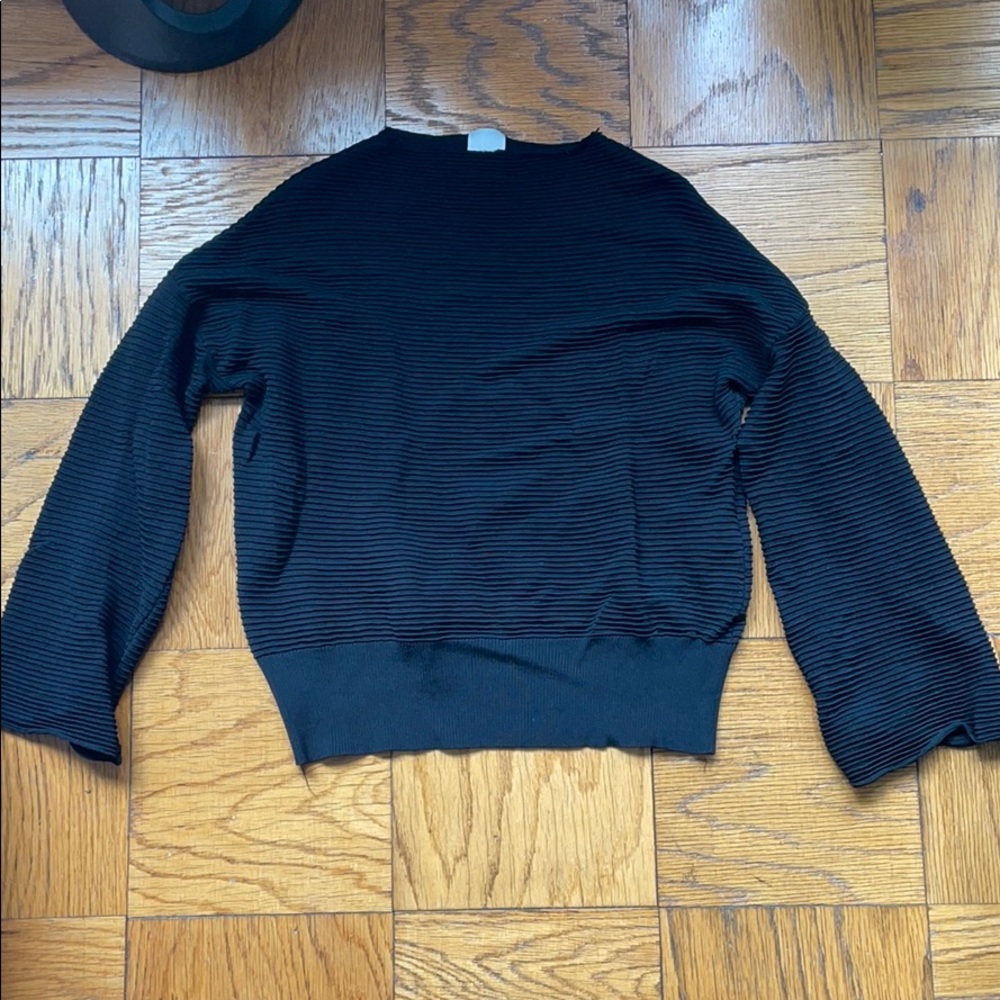 Textured black long sleeve top with flare sleeves